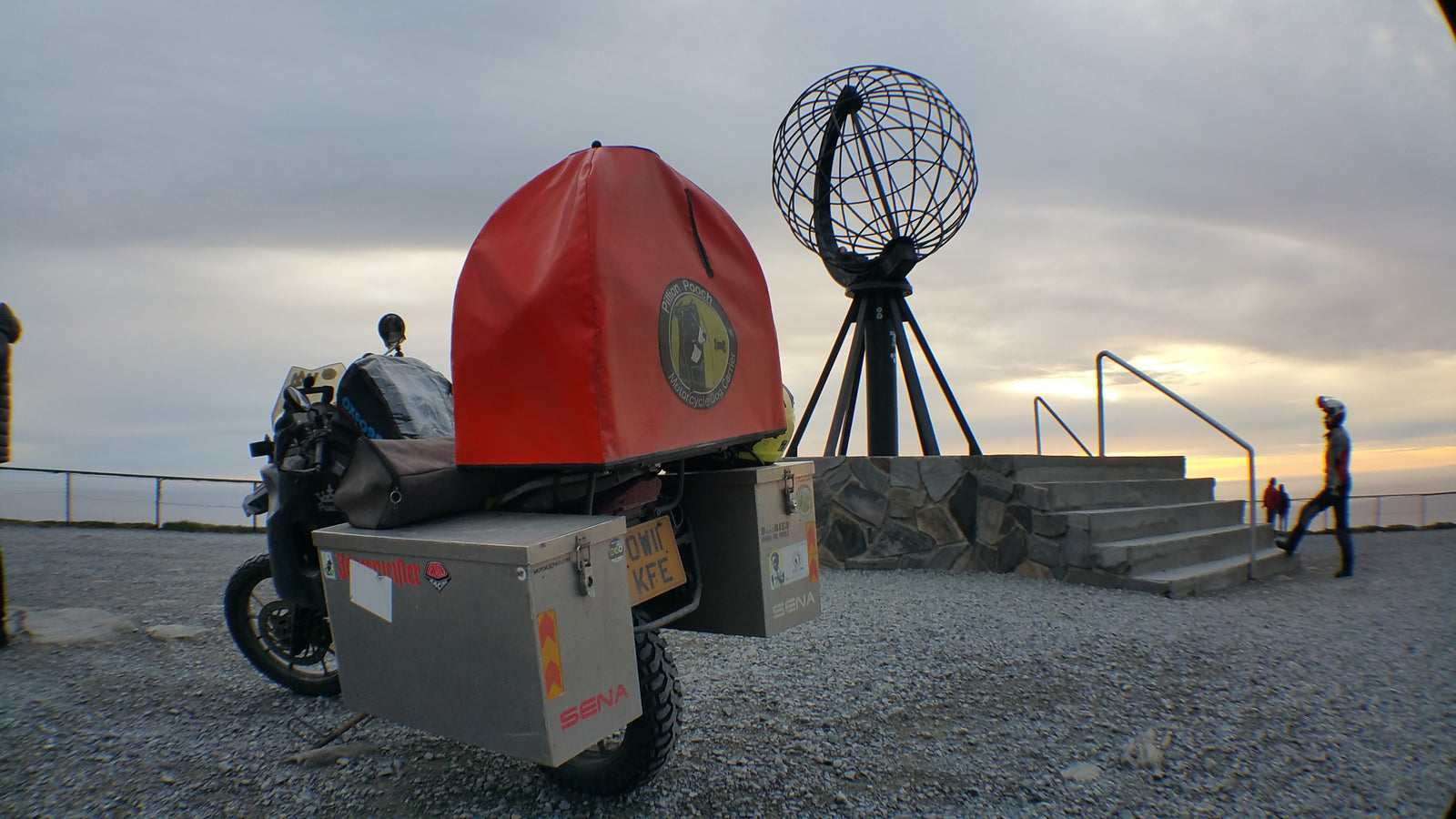 The Pack Track rode to the top of Norway to see the midnight sun. Got a great photo of the Pillion Pooch at the monument.