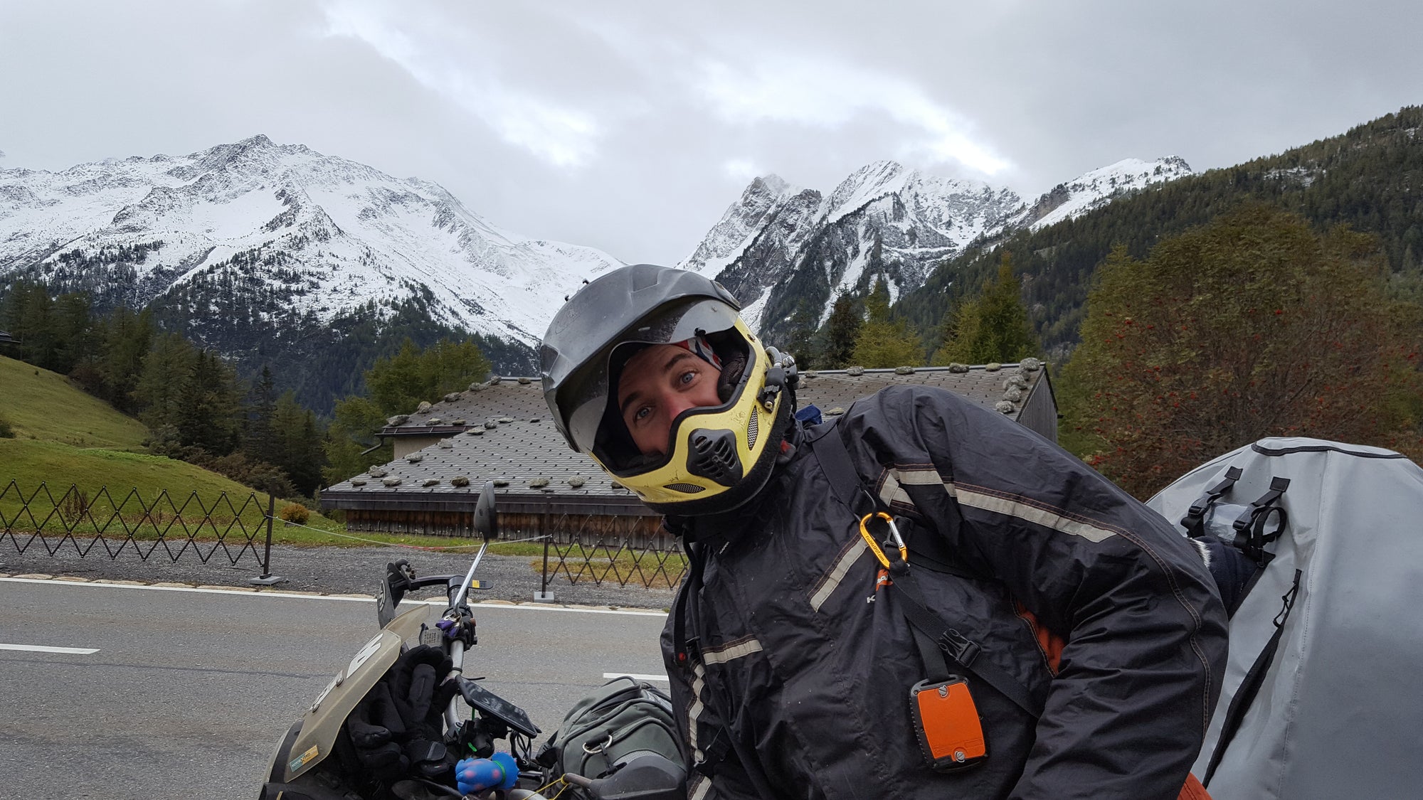 It was cold riding the Swiss Alps in October. But not too cold for Stu to ruin a perfectly nice photo of the snow capped mountains.
